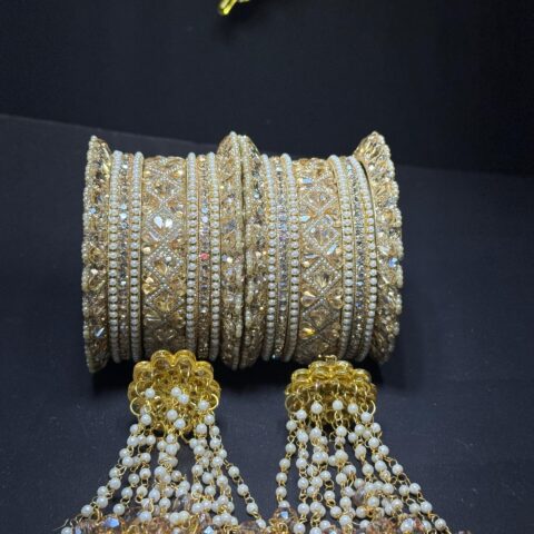 Regal Gold-Toned Bridal Chura Bangle Set with Intricate Kundan Work and Pearl-Drop Latkan Hangings (Set of 2)