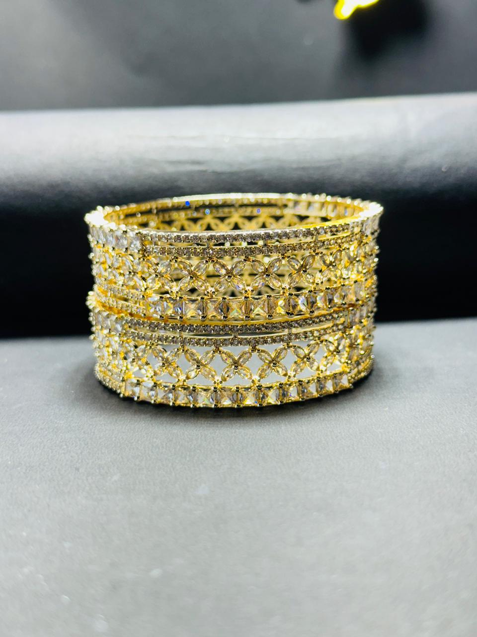 Exquisite Gold-Plated Floral Cut-Work Bangles with American Diamond & Baguette Stone Studding – Set of 2 (Kangan Style)