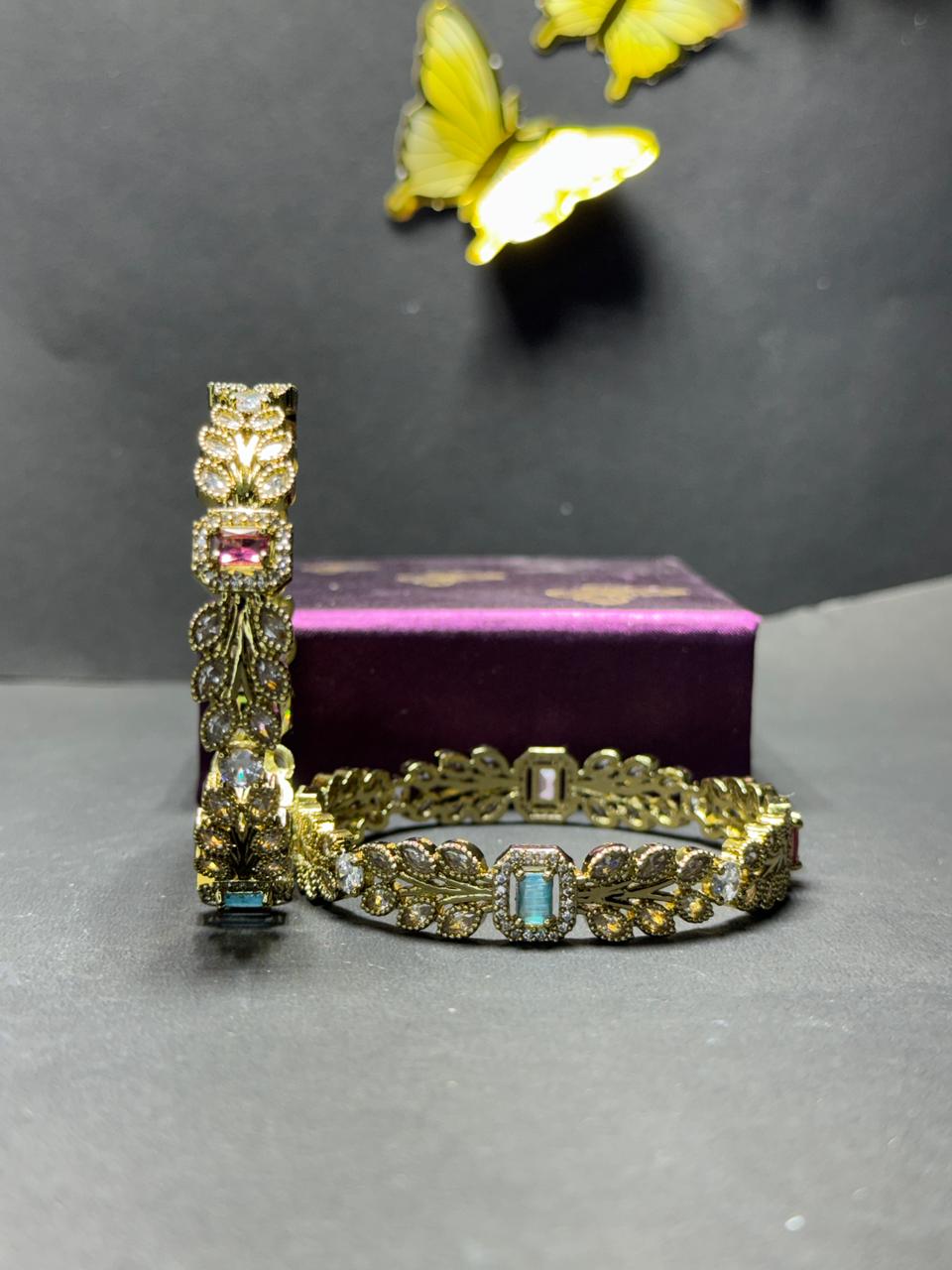 Regal Gold-Plated Leaf Motif Bangles – Multi-Color Baguette Gemstones with Shimmering Marquise Crystal Leaves (Set of 2) - Image 5