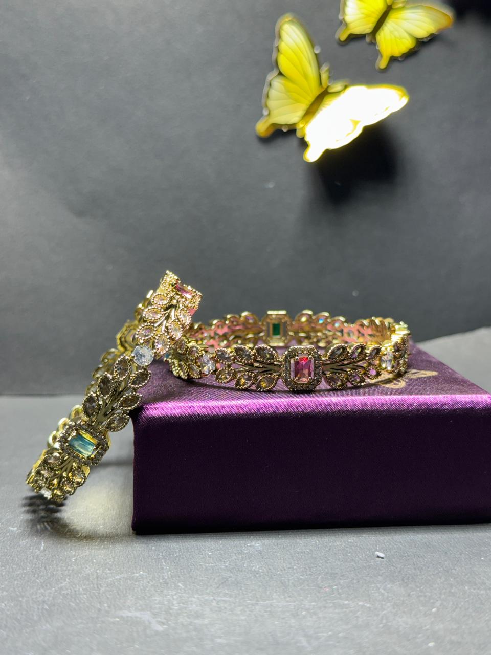 Regal Gold-Plated Leaf Motif Bangles – Multi-Color Baguette Gemstones with Shimmering Marquise Crystal Leaves (Set of 2) - Image 4